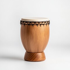 Wooden drum with natural finish and white drumhead on a light background for music and cultural themes