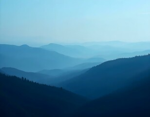 Obraz premium Misty mountain landscape, layered blue hills, atmospheric perspective, hazy horizon, ethereal scenery, soft gradient, serene vista, dreamy skyline
