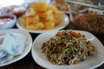 Burmese tea leaf, addictive salad with a combination of textures and savory, salty, mildly sour flavors