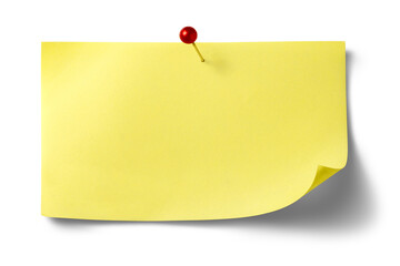 赤い押しピンで留められた、黄色いメモの紙片