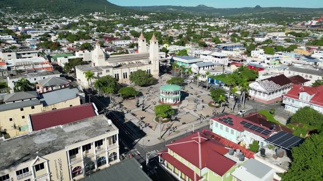 Aerial view of Parque Independencia and Catedral de San Felipe Ap&oacute;stol in the historic center of Puerto Plata in the Dominican Republic with Pico Isabel de Torres and the harbor in the background