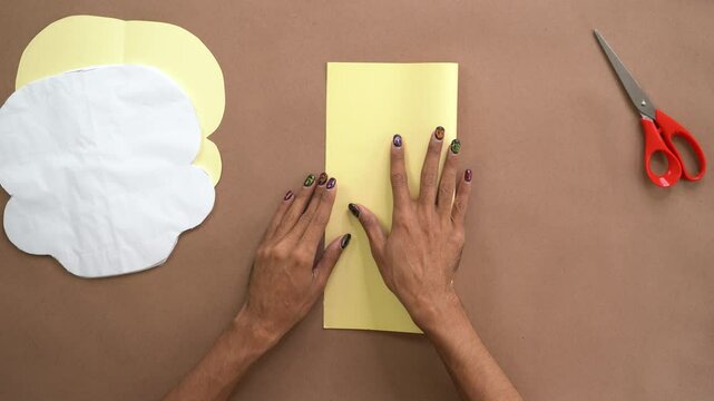 How to properly fold a sheet of cardboard in half