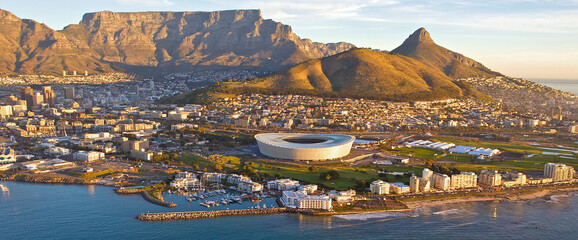 Aerial sunset view of the beautiful city of  Cape Town, South Africa, as seen from above. Table Mountain and Lions Head clearly visible in the background 
