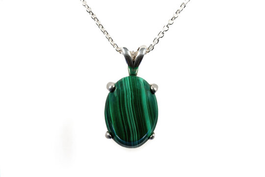 Malachite oval cabochon pendant, 16 x 12mm. Sterling silver setting and chain. White background.
