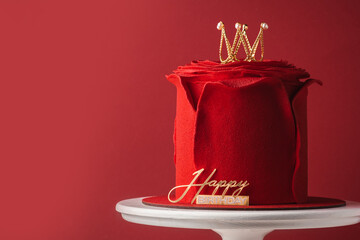 Beautiful queen or princess themed red cake with mastic rose petals in the shape of flower. Luxury...