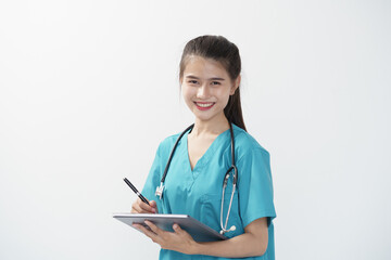 Portrait of Asian doctor woman standing holding pen and writing on clipboard in white studio background