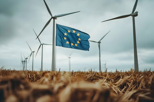 EU flag waves amidst wind turbines in field