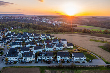 Aerial view of a new development area with modern homes in Waiblingen, Baden-Wuerttemberg, Germany at sunset.
