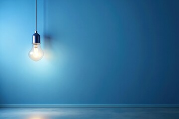 Illuminated Interior A Single Hanging Lightbulb Casts a Soft Glow Against a Serene Blue Wall