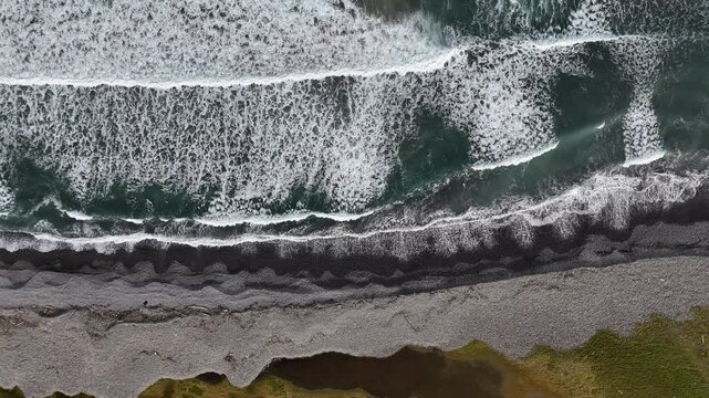 Majestic Aerial View of Ocean Waves Crashing on the Rugged Coast of Langanes Peninsula, Iceland