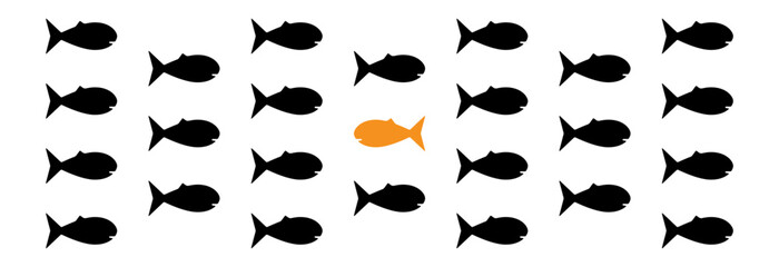 A fish swimming against a crowd of fish in the other direction. A concept showing individual thinking, one's own unimposed personal path and achievements.