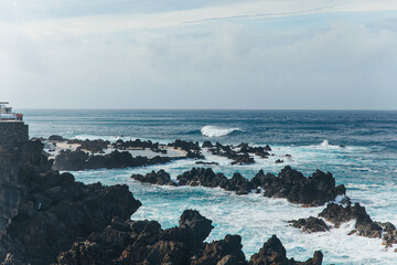 The black scales contrast with the clear oceanic waves, The stones are powerful and the stone is...