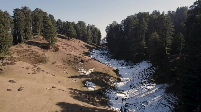 View of the ancient Moila Top in Chakrata, with a lush green mountain trail winding through rocky terrain, offering breathtaking vistas of nature. Moila Danda, Chakrata, Uttarakhand, India.