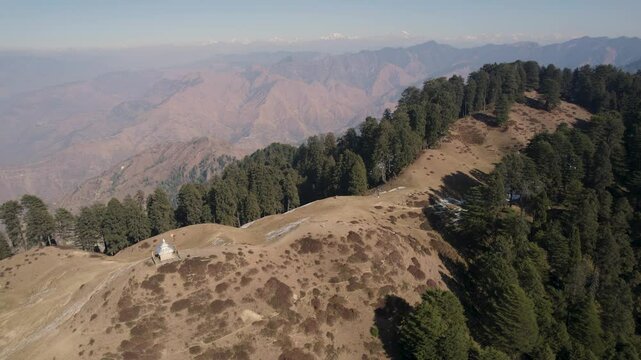 View of ancient moila top on chakrata with a lush green mountain trail winding through rocky terrains, offering breathtaking vistas of nature, Moila Danda,, Chakrata, Uttarakhand, India.