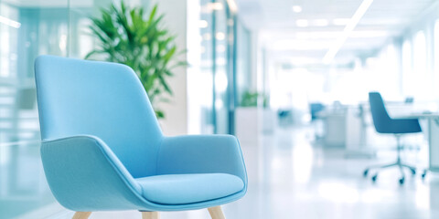 Modern blue office chair in bright contemporary workspace with minimalistic design and green plant decor