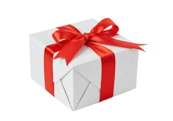 A neatly wrapped white gift box with a bright red ribbon and bow, isolated on a white background