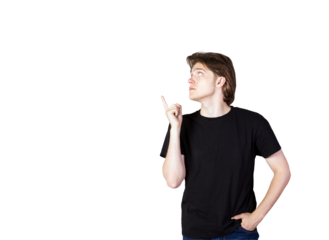 Young man in ashirt pointing upwards with one finger, isolated on a clean white background. Concept of idea, awareness, or attention