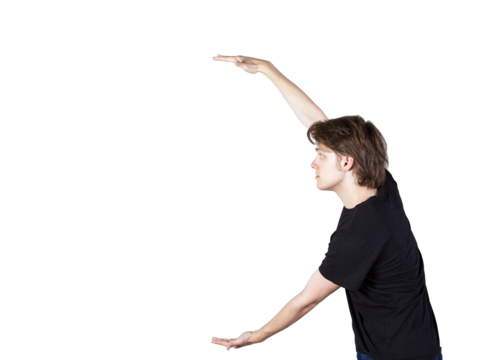 Young man in casual attire gesturing with arms, appearing to hold an invisible object. Isolated on white background. Concept of presentation or demonstration