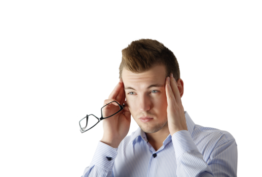 Young man holding glasses with one hand and massaging his temples with the other, wearing a striped shirt, isolated on a white background, concept of stress or headache - Powered by Adobe