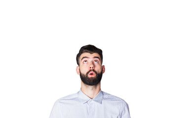 Obraz premium Closeup of a bearded man in a light shirt looking upward with a surprised expression, isolated on a white background, concept of curiosity