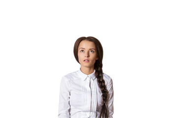 Portrait of a woman with a side braid wearing a white shirt, gazing upwards thoughtfully. Isolated...