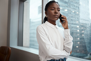 Black woman, phone call and talking to contact in office, serious journalist and quote for media....