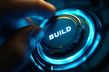 A conceptual close-up of a developer’s finger approaching a luminous "BUILD" button, representing automation and digital progress