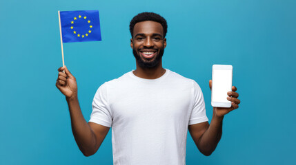 Europe Day. Travel and tourism. A black guy waves a small European flag and holds a phone with an empty white screen in his hand on a blue background. Phone mockup. The annual celebration