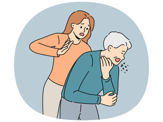 Woman performs heimlich maneuver for choking old man who needs help due to airway obstruction. Sick human choked on food and coughed standing near girl ready to do heimlich maneuver