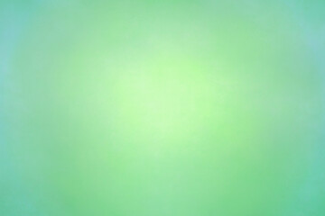 中心が明るい淡くぼやけた緑色の背景