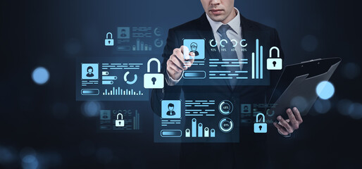 Businessman interacting with digital security interface on a dar