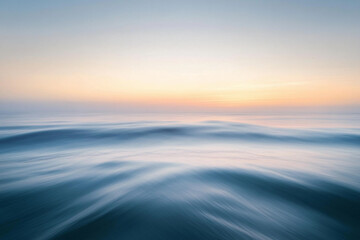 Fototapeta premium Sunset over calm ocean waters creates a serene atmosphere with vibrant colors on the horizon