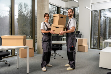 Young people working together with sorting the parcel in a packaging office