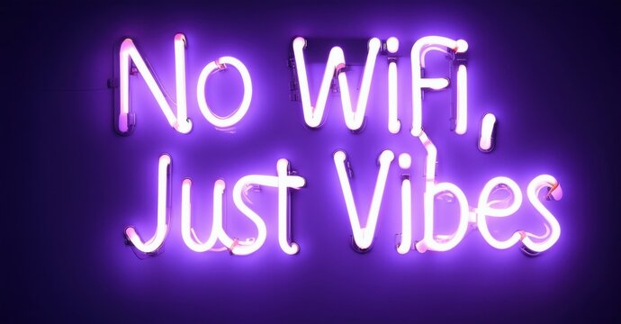 Electric neon letters forming No WiFi Just Vibes shining in deep purple glowing warmly on dark background creating modern stylish ambiance with chill relaxed digital detox energy