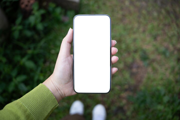 Smart phone mockup. Women hands holding cell telephone blank copy space screen smartphone blank white screen isolated technology concept.