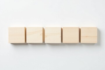 Five blank wooden blocks on a clean white background. Minimalist, template, copy space concept.