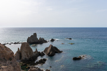 kayaks crossing between the reefs at sea