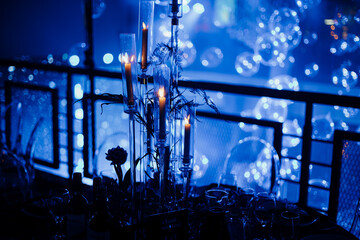 Elegant Candlelit Dinner with Dreamy Blue Reflections