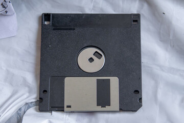 old floppy disk for the computer. an antique, classic data carrier with small internal memory on...