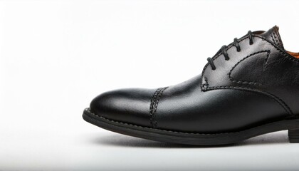 a classic black leather oxford shoe with a lace-up closure. The shoe has a sleek and elegant design, perfect for formal occasions