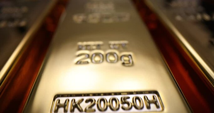Gold bars reveal luxurious gleaming surfaces in bank storage. Precious metals intrinsic value within global financial markets and investment