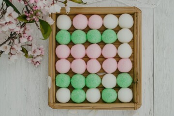 Mochi (Japan) An overhead shot of colorful mochi arranged on a bamboo tray