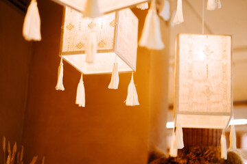 Beautiful handmade lanterns hanging in a warm and inviting space featuring soft lighting