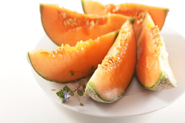  Fresh Melon Slices on a Plate