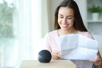 Happy woman checking smart speaker instruction manual