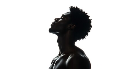 Fototapeta premium A silhouette of a man with natural hair, gazing upwards, against a bright white background, capturing a moment of contemplation and introspection.