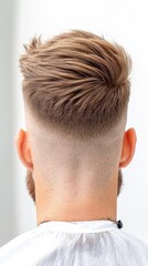 Fototapeta premium A man with a shaved head and a beard