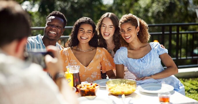 Friends, food and smile with photography outdoor for new year celebration, social event or profile picture update. Happy memory, diversity people and festive lunch on terrace with bonding and party