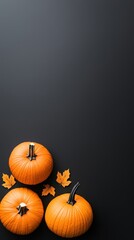 Three pumpkins are on a black background