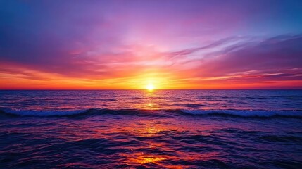 Obraz premium Sunset over ocean waves nature idea. Stunning sunset over the ocean with vibrant colors reflecting on the water.